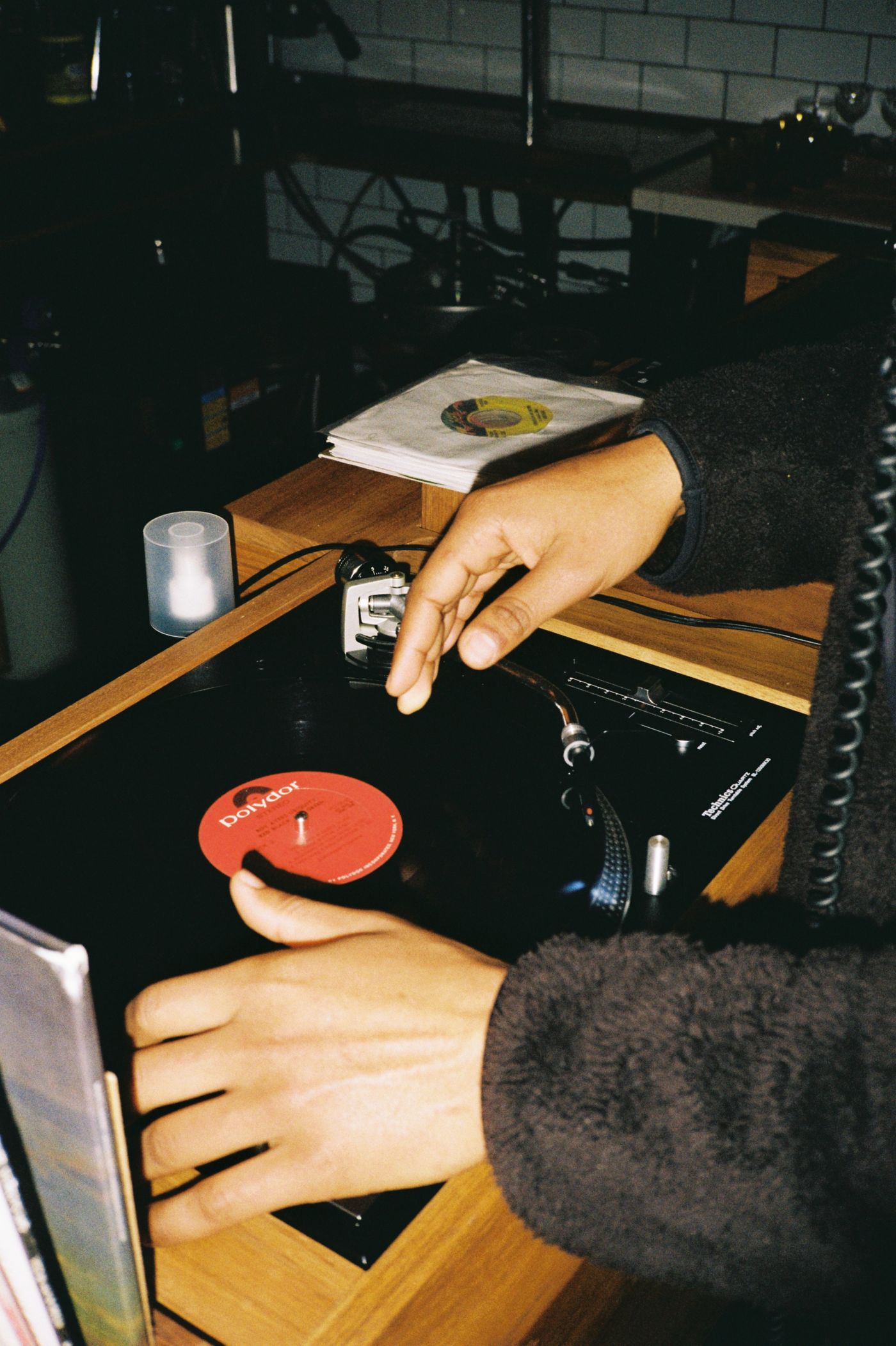 A DJ playing a record at Waxflower in Melbourne