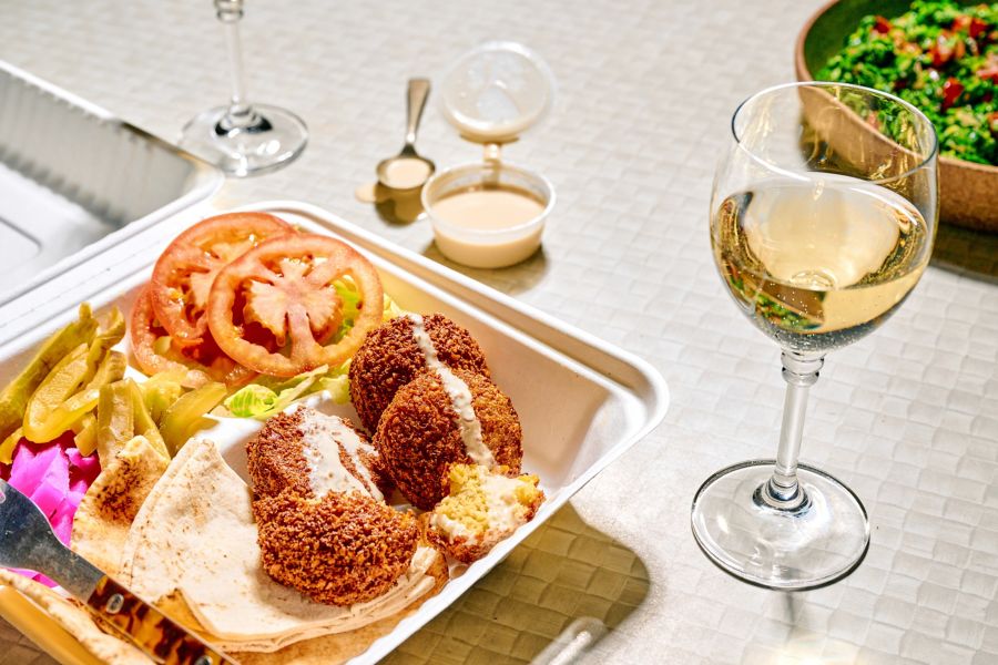 Falafels and hummus with a glass of viognier