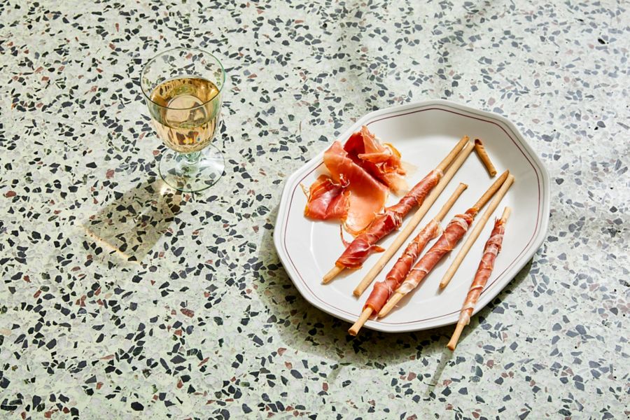 Prosciutto and grissini with a glass of rosé
