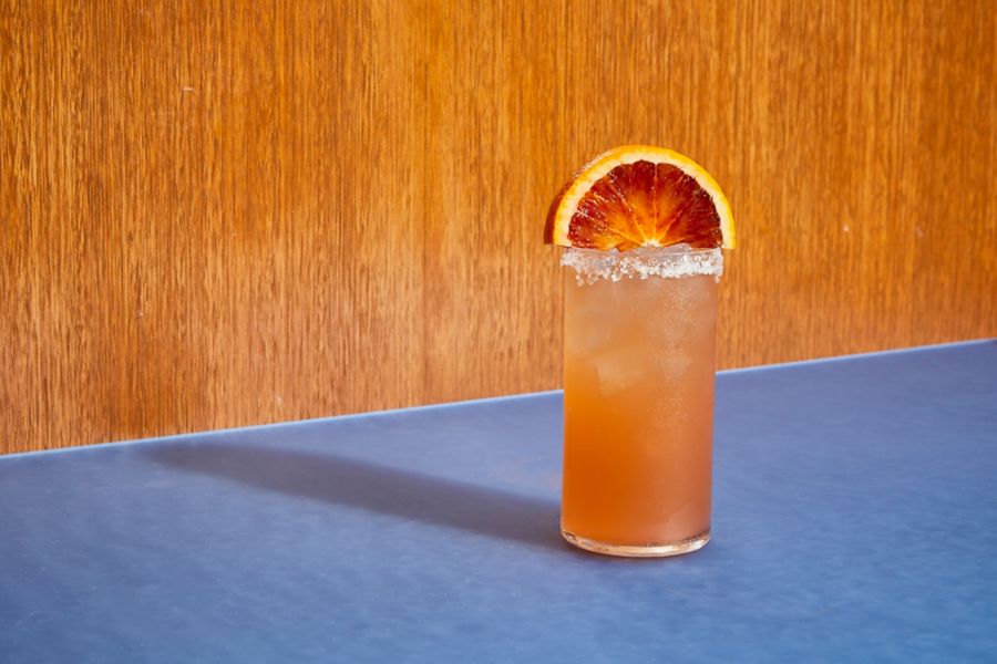 The Blood Orange Paloma heroes tequila with orange garnish