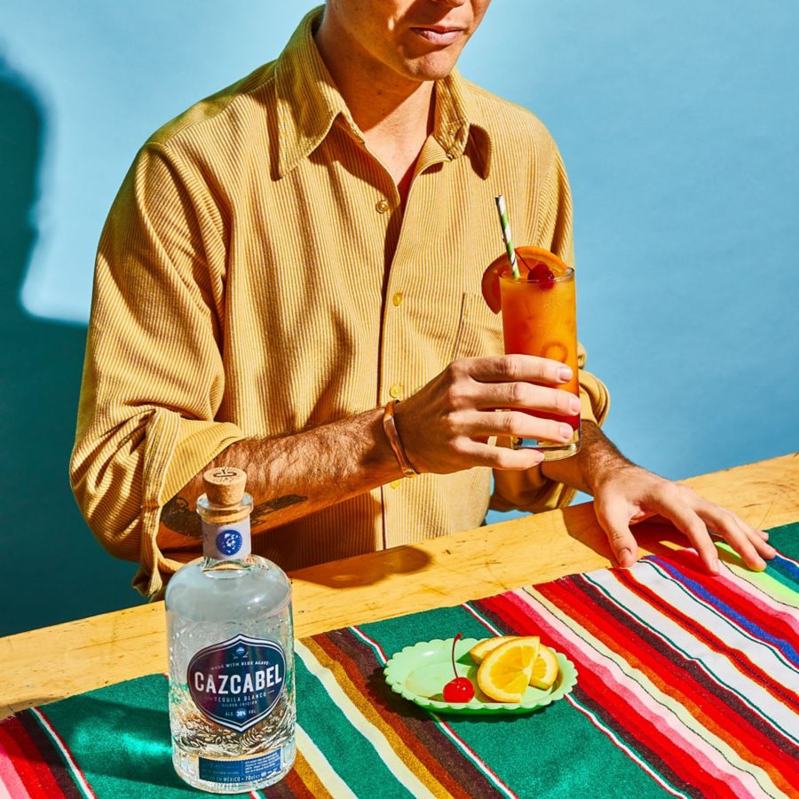 Holding a cocktail made from tequila