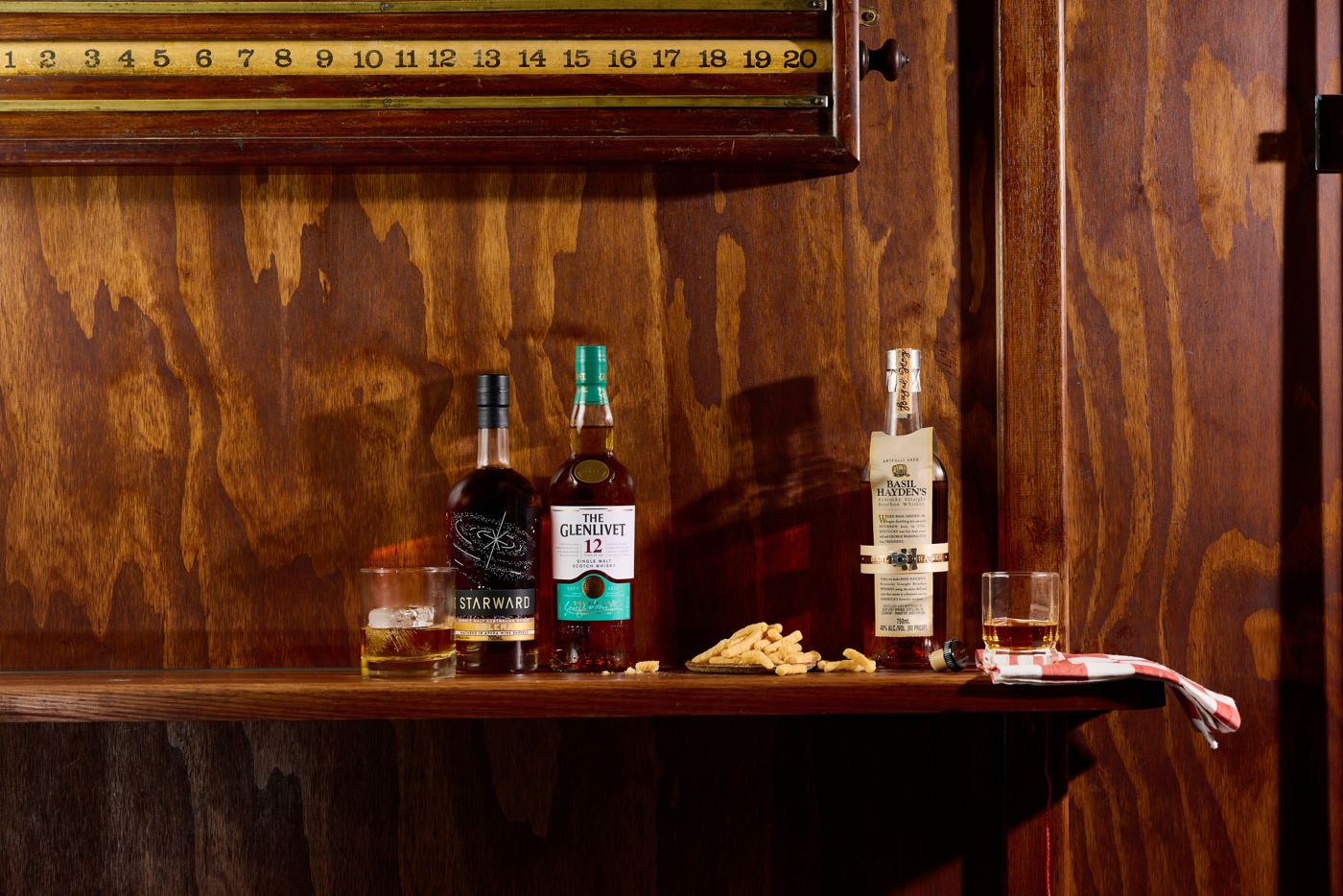 Bottles of whisky on a wooden shelf