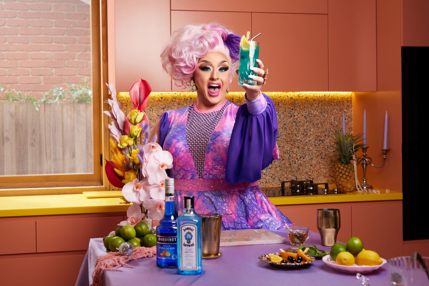 Sasha Starr with a Sapphire Summer Punch cocktail