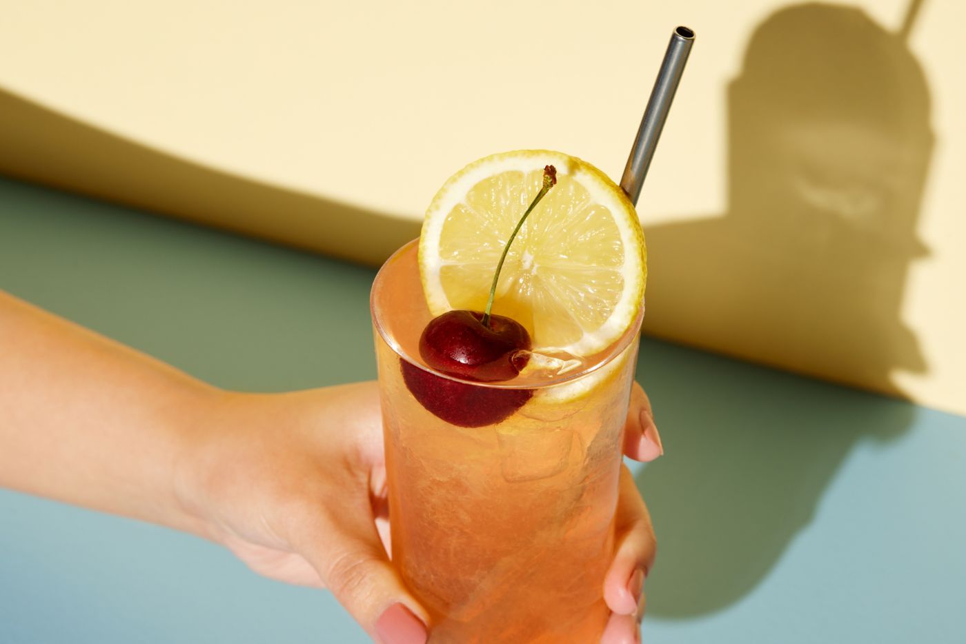 Holding a Sloe Gin Fizz