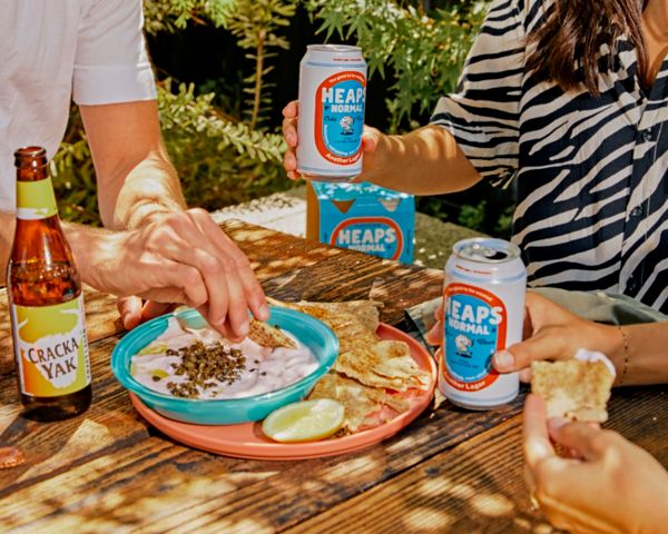  Put down the stale pretzels and try elevated snacks (like pan seared saganaki drizzled with honey) instead. 
