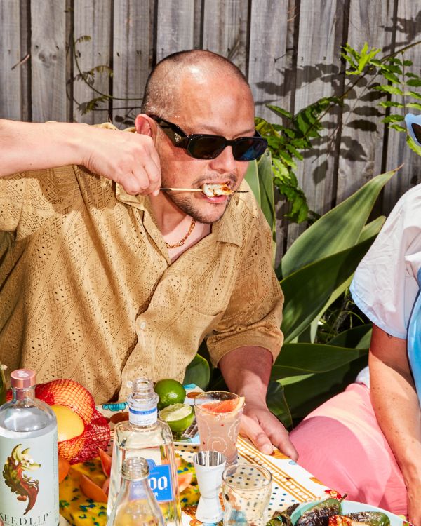 Raph eating squid skewer