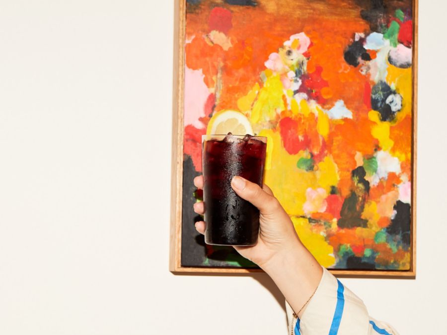 Holding up a Kalimotxo, which combines Coke with red wine