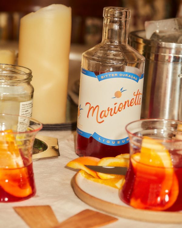 Marionette Liqueur on table with cocktails