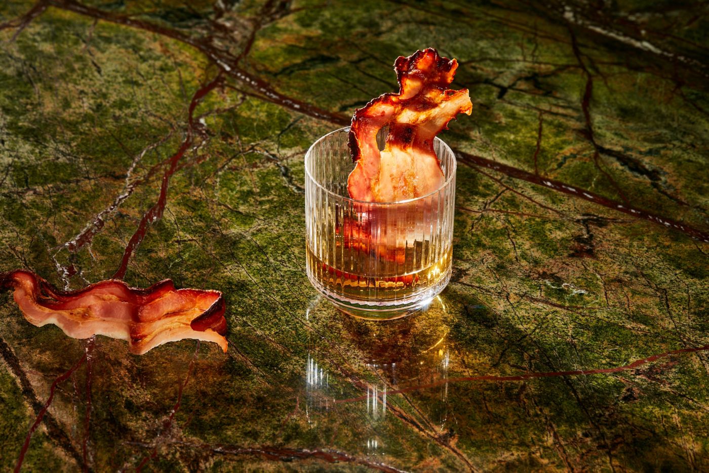 A bacon-washed Old Fashioned, with a crispy bit of bacon as garnish