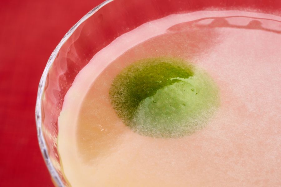 Looking into a glass of the Mujer Verde cocktail