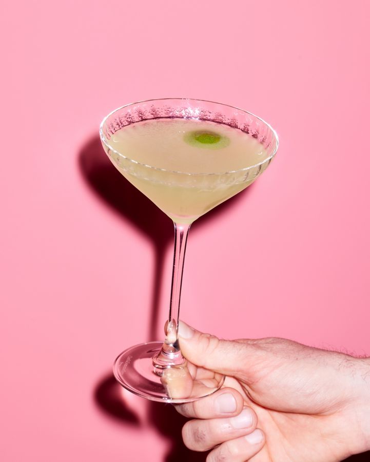 Holding the Mujer Verde cocktail