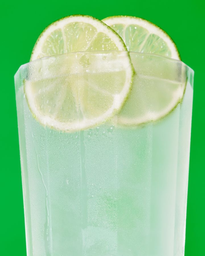 The Ranch Water up close, with lime wheels as garnish