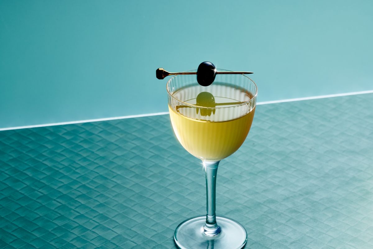 The Bijou cocktail with a cherry garnish