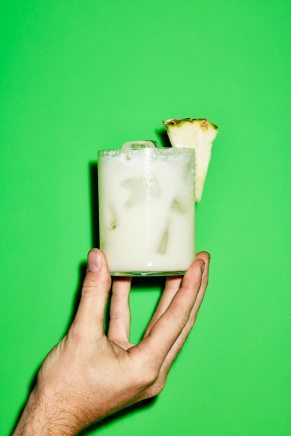 Holding a Pineapple and Coconut Margarita