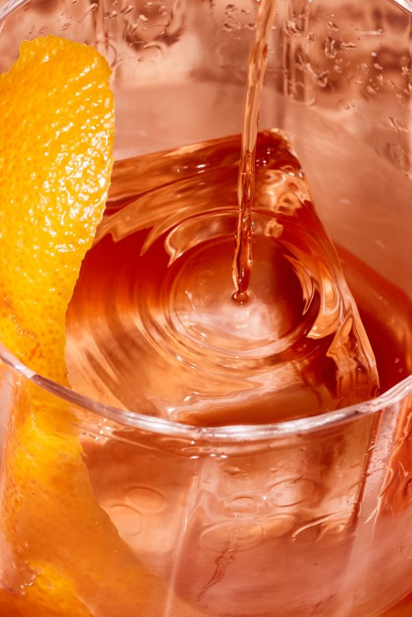 Pouring a Cold Brew Negroni into a glass  