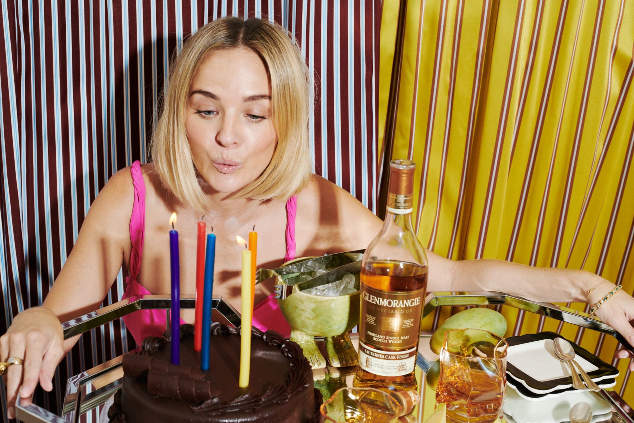 Nadia blowing out the birthday candles with Glenmorangie Scotch Whisky