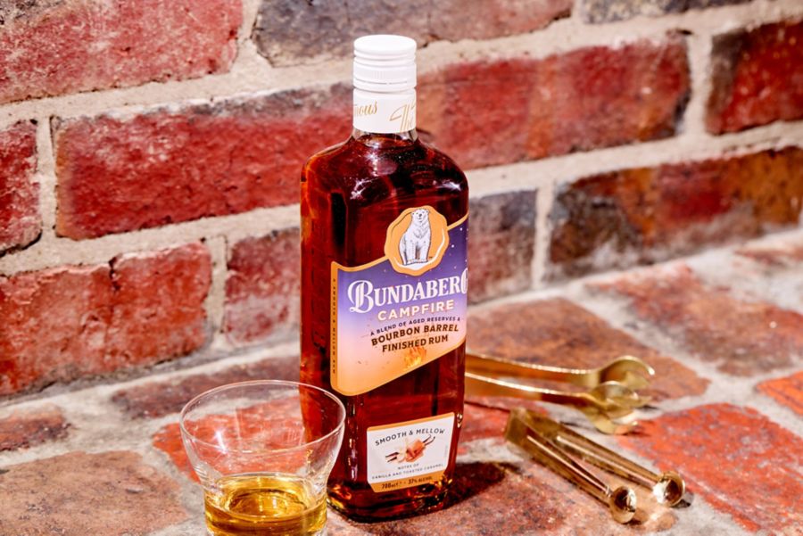 The Bundaberg Campfire Bourbon Barrel Rum with a glass of this spirit alongside