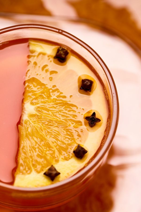 A close-up of the orange peel garnish, which is spiked with cloves