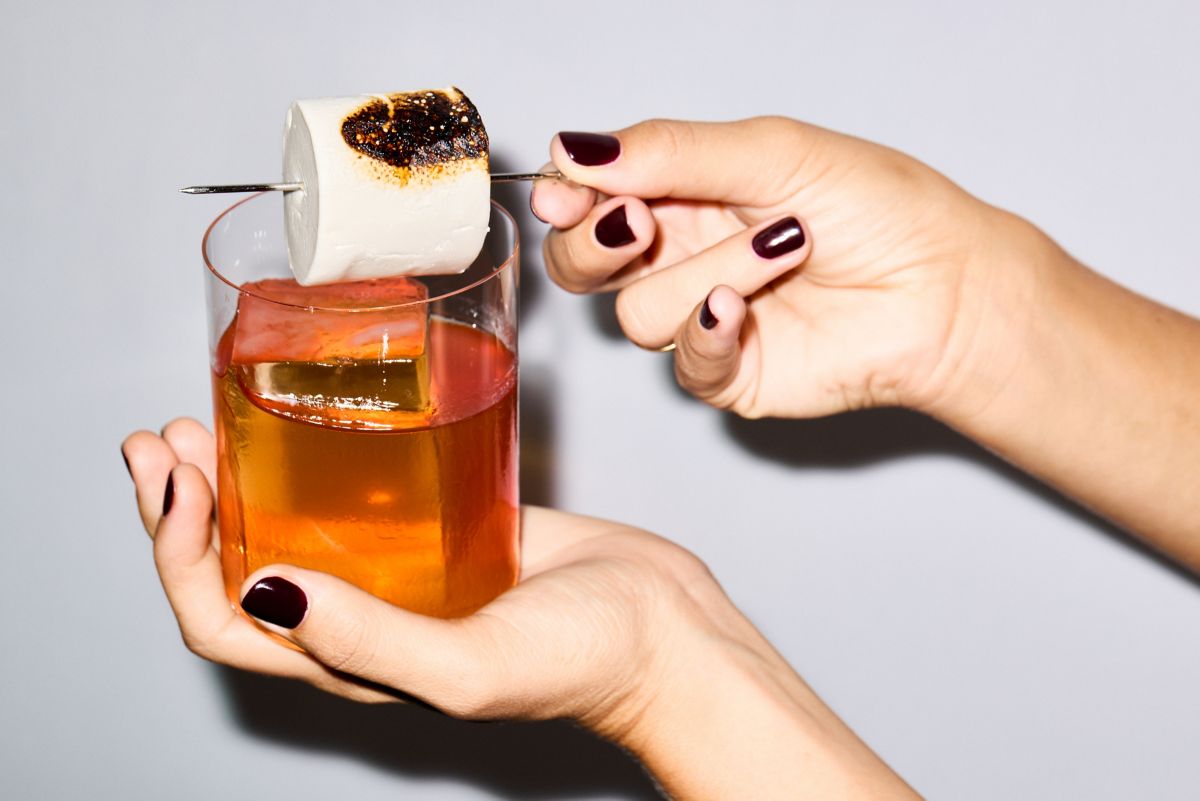 Holding a Toasted Marshmallow Old Fashioned cocktail