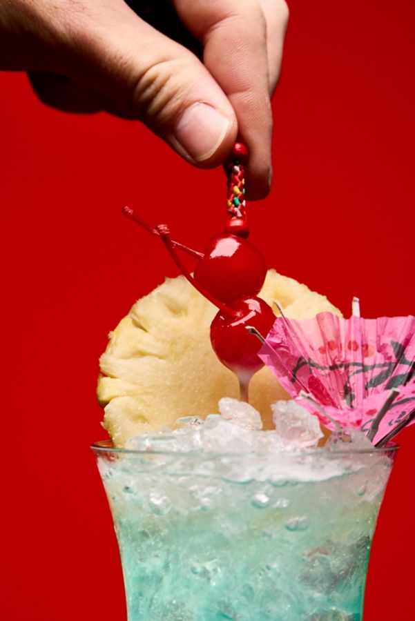 Garnishing a Blue Hawaii cocktail 