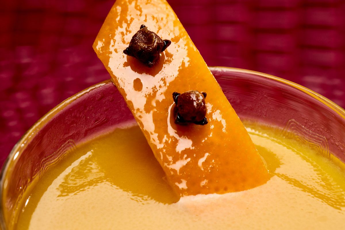 Clove-spiked orange peel makes a great garnish in the Hot Buttered Rum cocktail