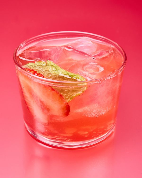 A glass of Strawberry Champagne Punch cocktail