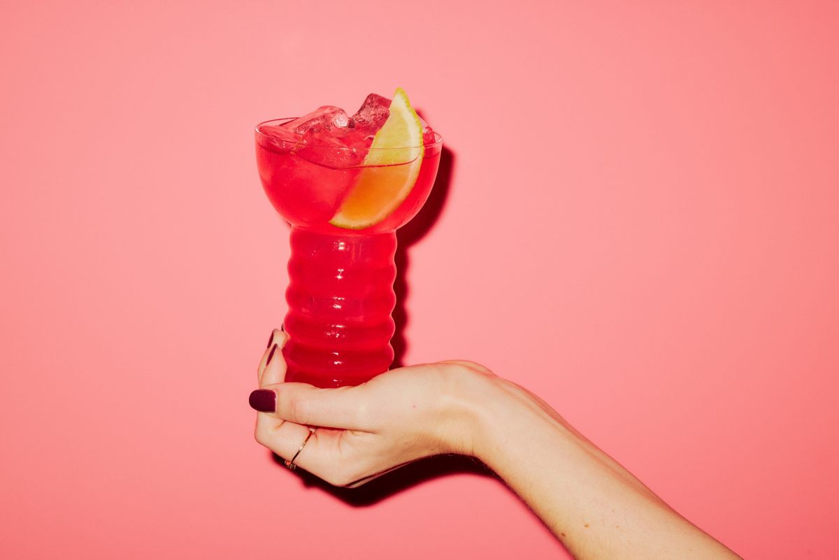 Holding the classic vodka cocktail, the Seabreeze 