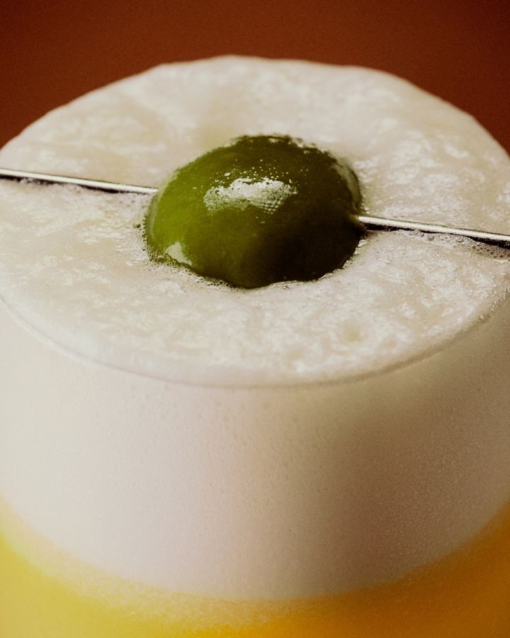The Oliveto cocktail has a frothy, silky texture thanks to olive oil and egg white 