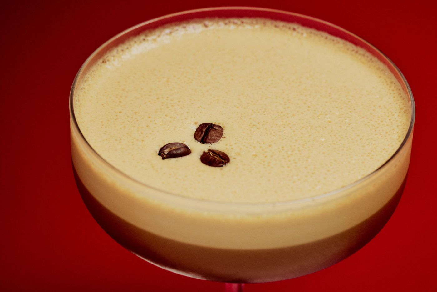 The frothy top of an Espresso Martini cocktail
