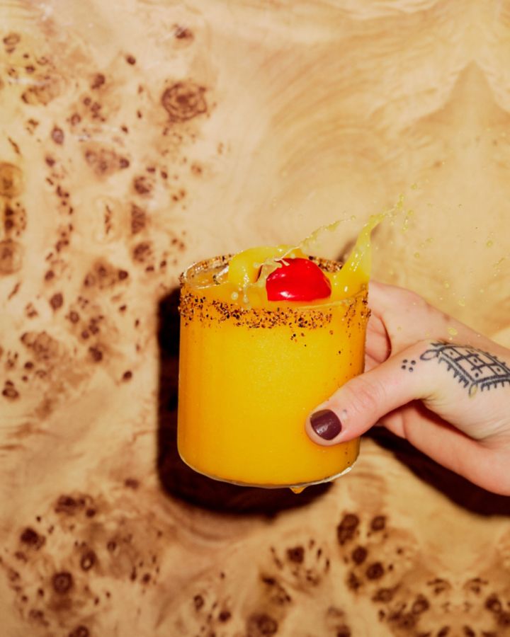 Holding the Spicy Mango Margarita