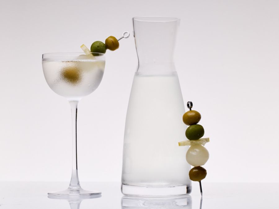 The Freezer Door Martini in a carafe and glass with skewered olives