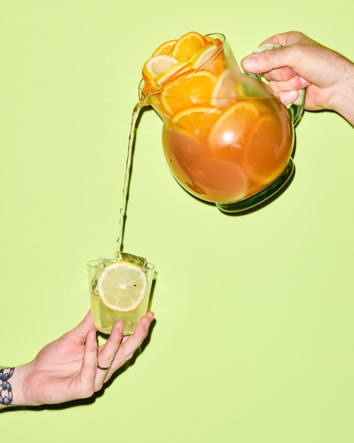 Pouring the Cranberry Limoncello Spritz into a glass 