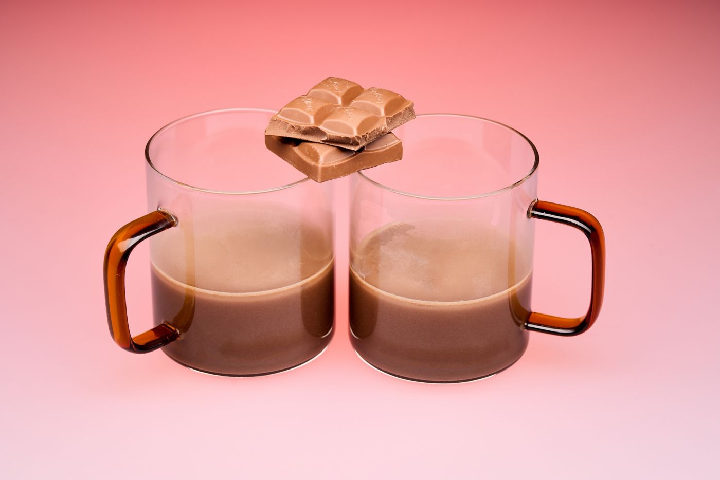 Two glasses of Dan's Hot Chocolate with chocolate  