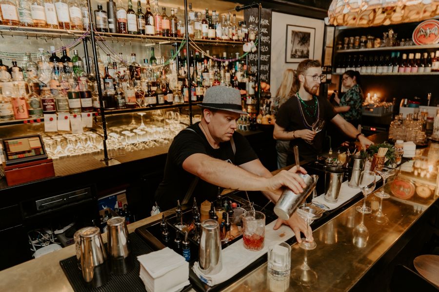 image of a cocktail and snacks served on table