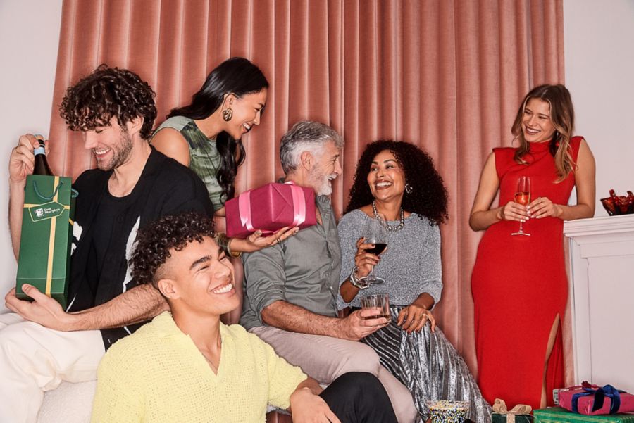 Two women drinking Espresso Martini cocktails at Christmas party
