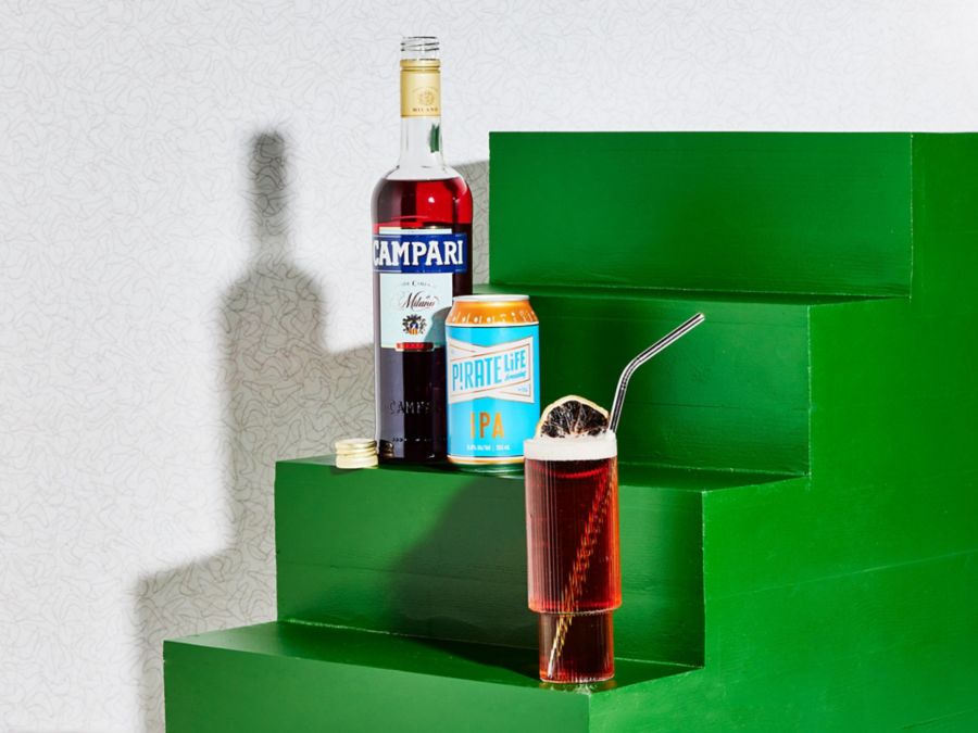 A bottle of Campari and a can of IPA, and the cocktail that mixes the two. 