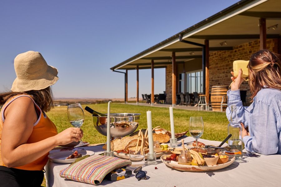 Enjoying a meal and drinks outdoors at the O’Leary Walker cellar door