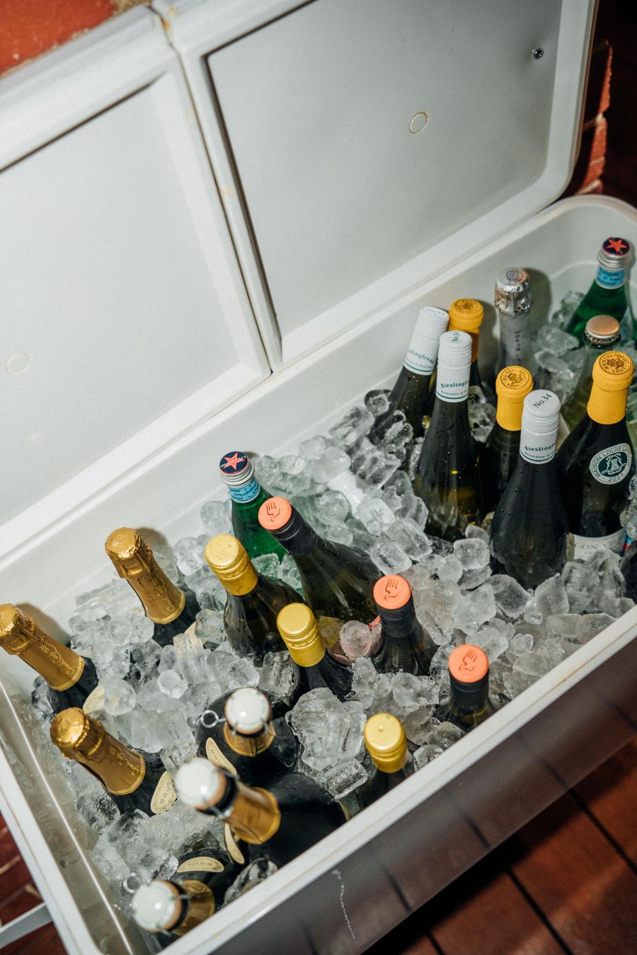 A large white drinks cooler becomes the drinks station 