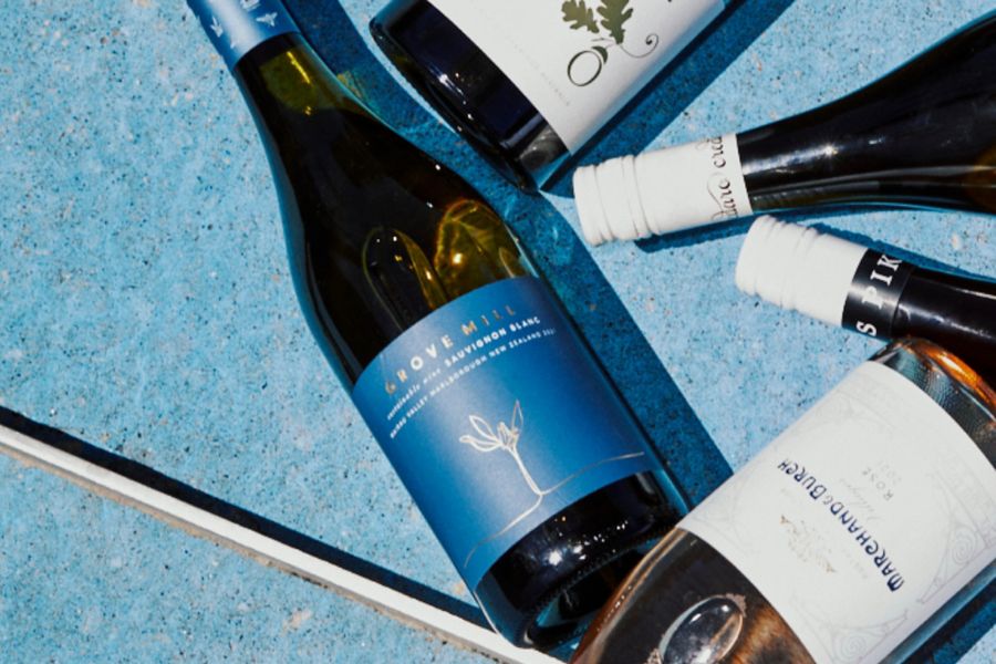 Picnic setting with a cheese board and cans of Liberty Coast Raspberry