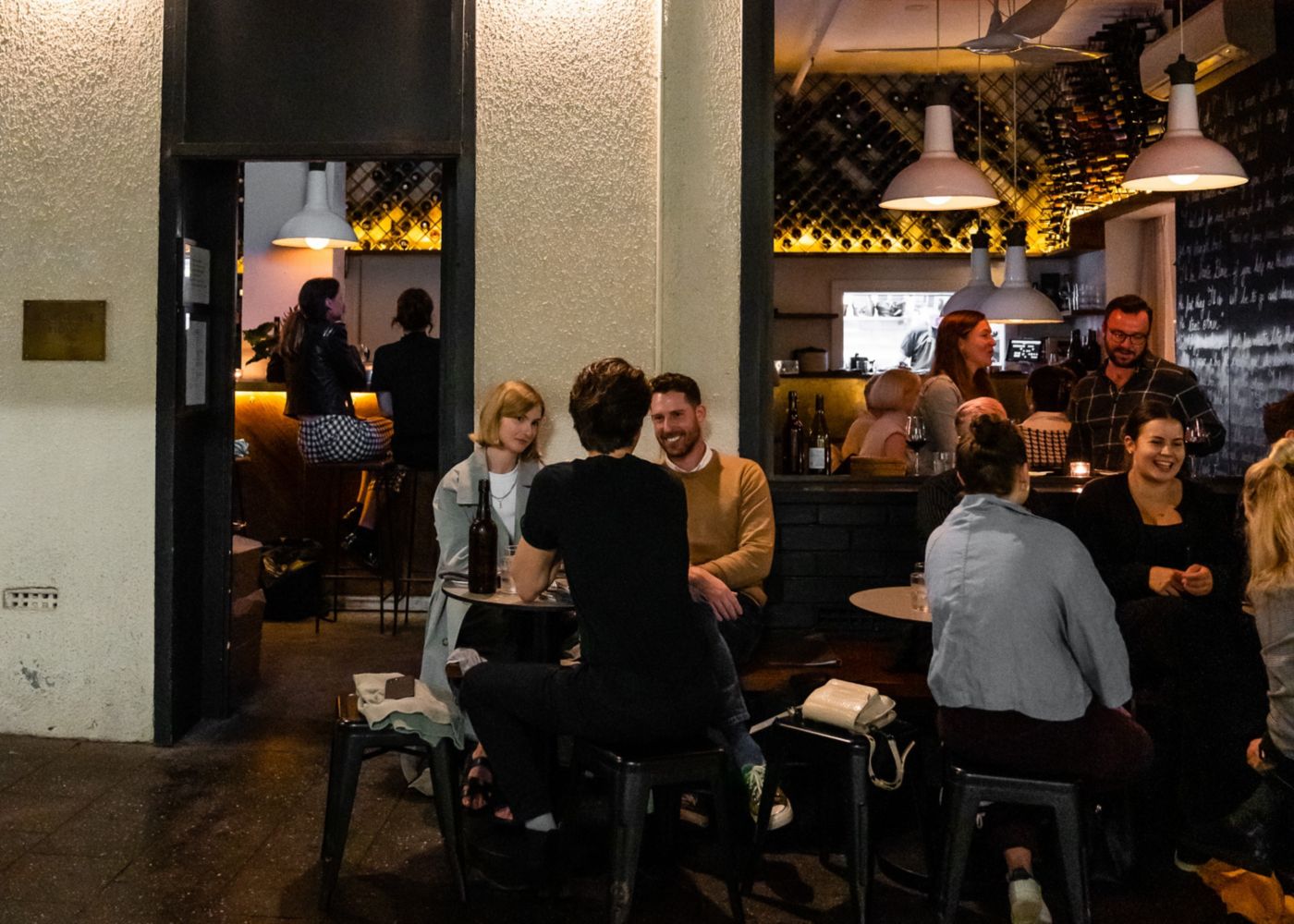 A couple being served wine at Dear Sainte Eloise in Sydney