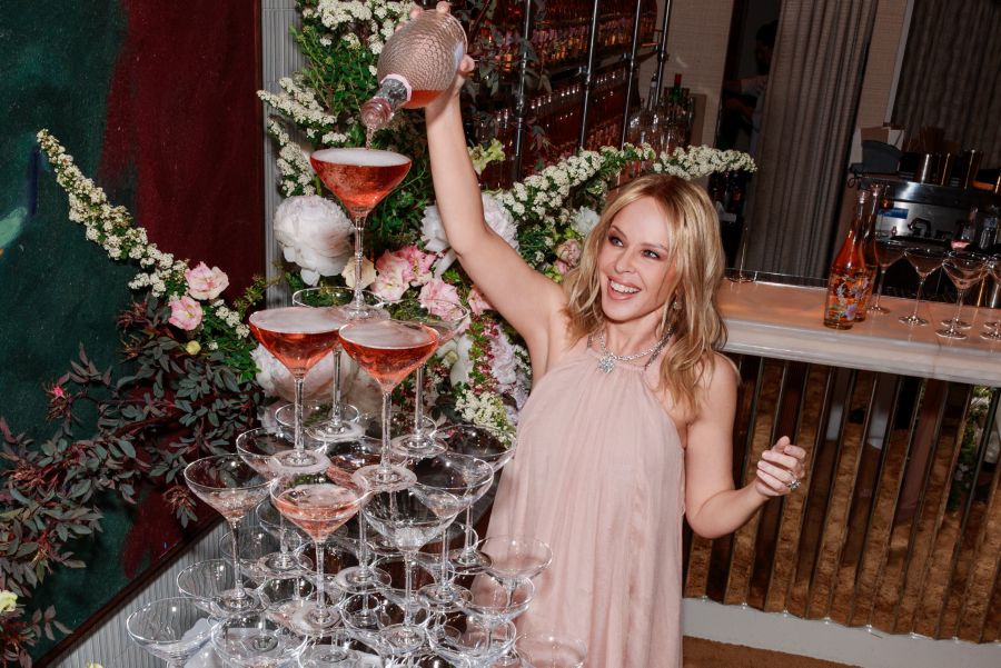 Kylie Minogue with a bottle of one of her Kylie Minogue Wines
