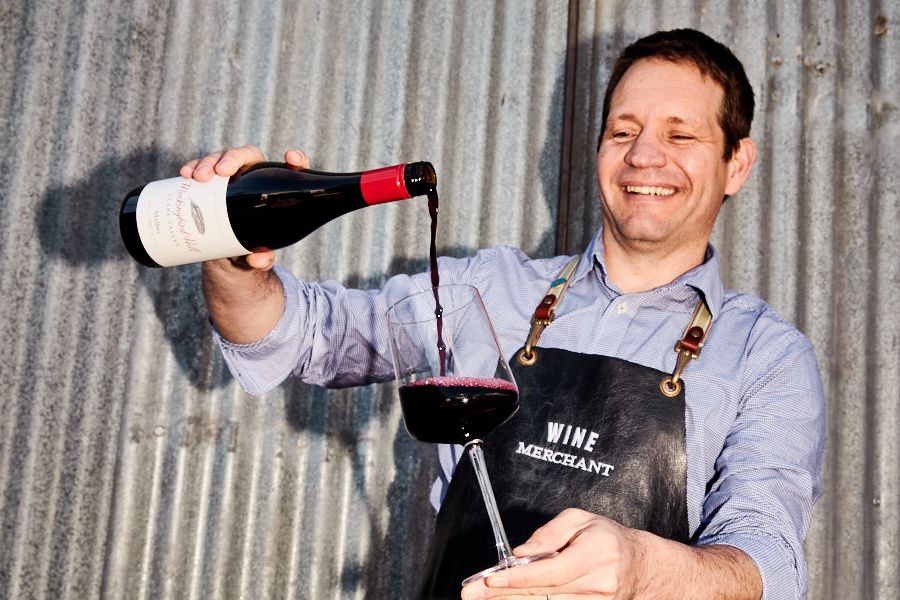 Dan's Wine Merchant Raphael Vigneau pouring a red wine 