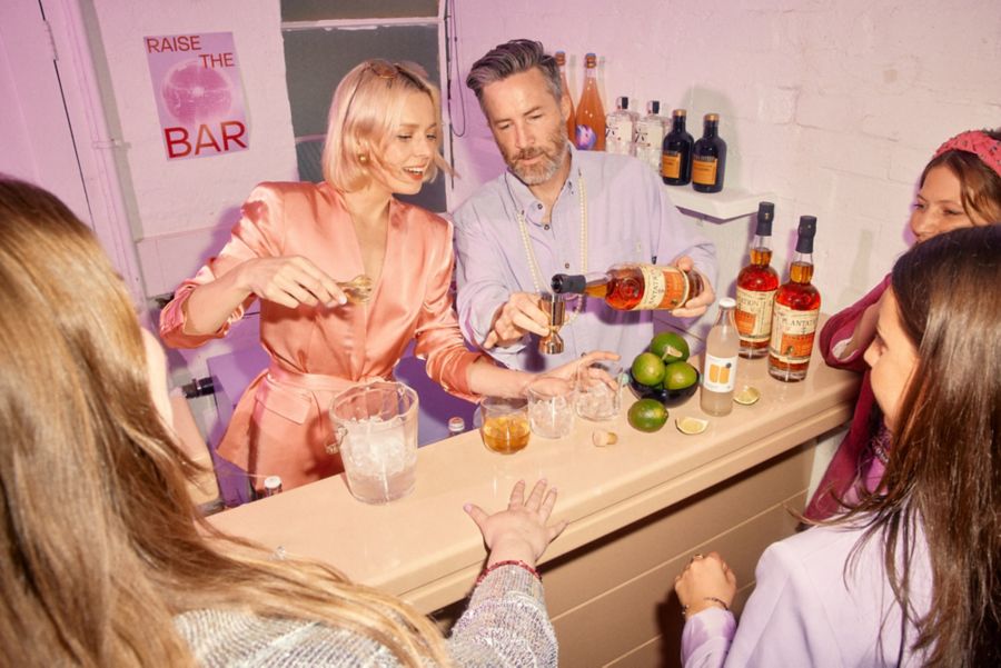 Chels & Stu making cocktails