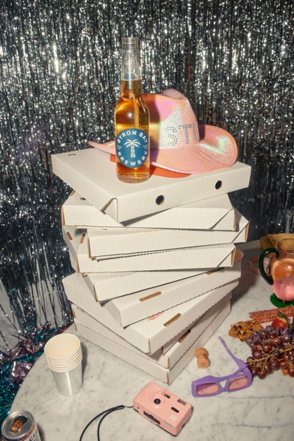 Byron Bay Brewery beer and pizza boxes on dining table