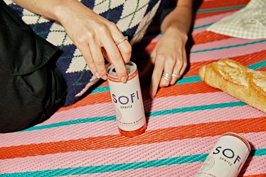 Opening a can of SOFI Spritz Blood Orange & Bitters