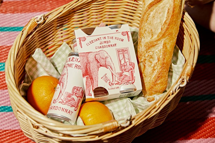 Elephant In The Room Chardonnay in a basket with picnic food