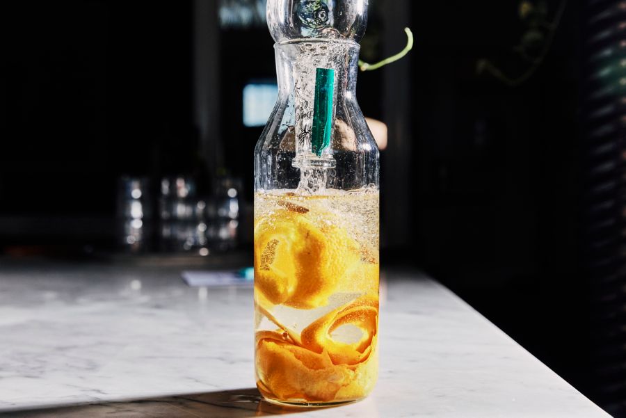 Orange peel infusing in mezcal