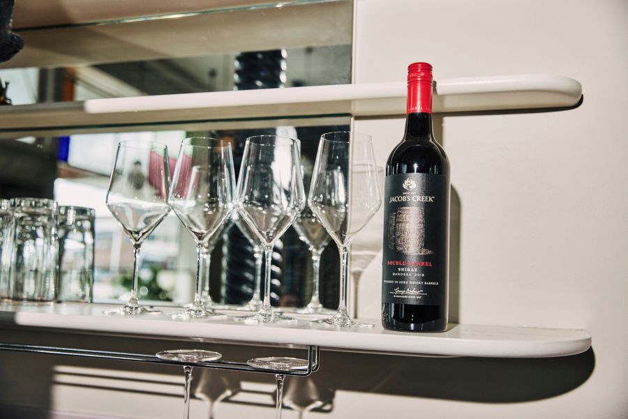 The Jacob's Creek Double Barrel Shiraz on a shelf with glasses