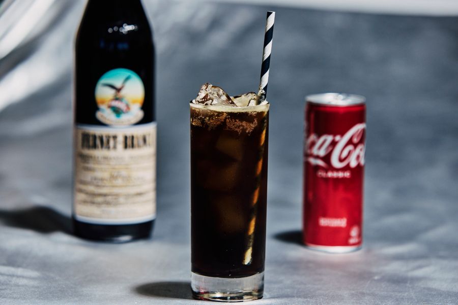 Coca-Cola mixed with Fernet Branca in a tall glass with ice