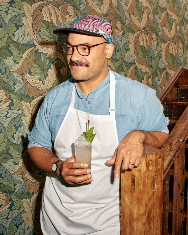 Matt Stirling bartender from Caretaker's Cottage holding a Mojito 